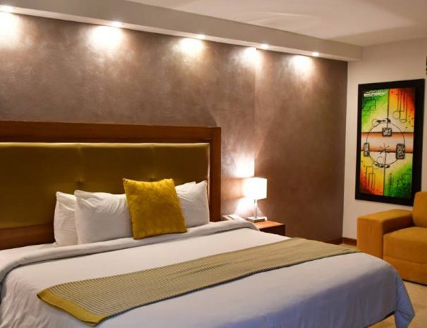 cama en habitacion suite ejecutiva de oceania hotel boutique en maracaibo
